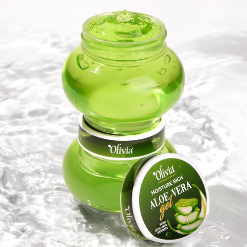 Aloe vera gel in a green jar and round container, with water droplets in the background.